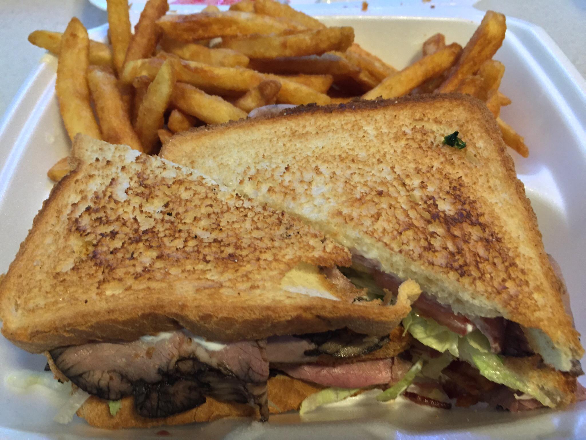 Club sandwich and French fries at Epsom House of Pizza